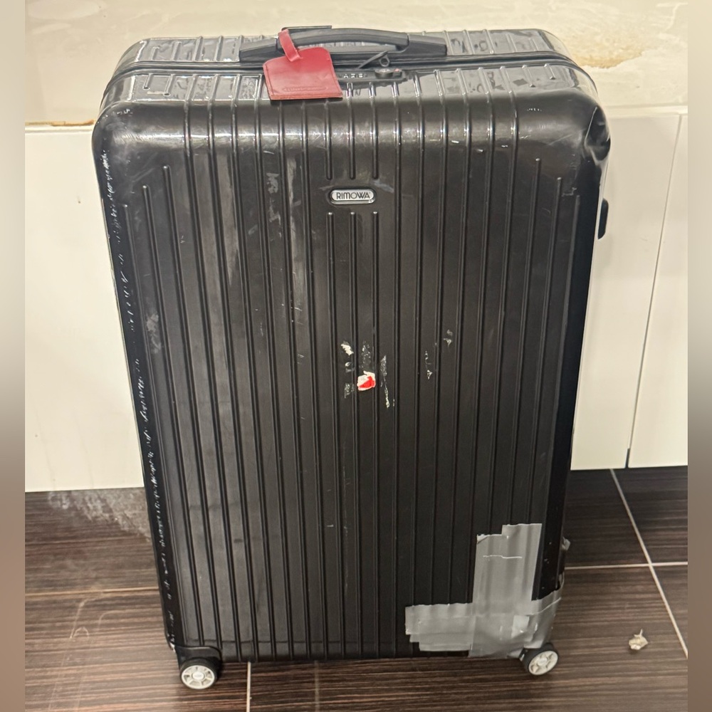 RIMOWA Black Hard-Shell Spinner Luggage Suitcase Check On